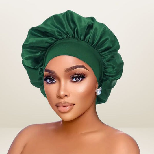 Woman wearing a green satin bonnet against a beige background