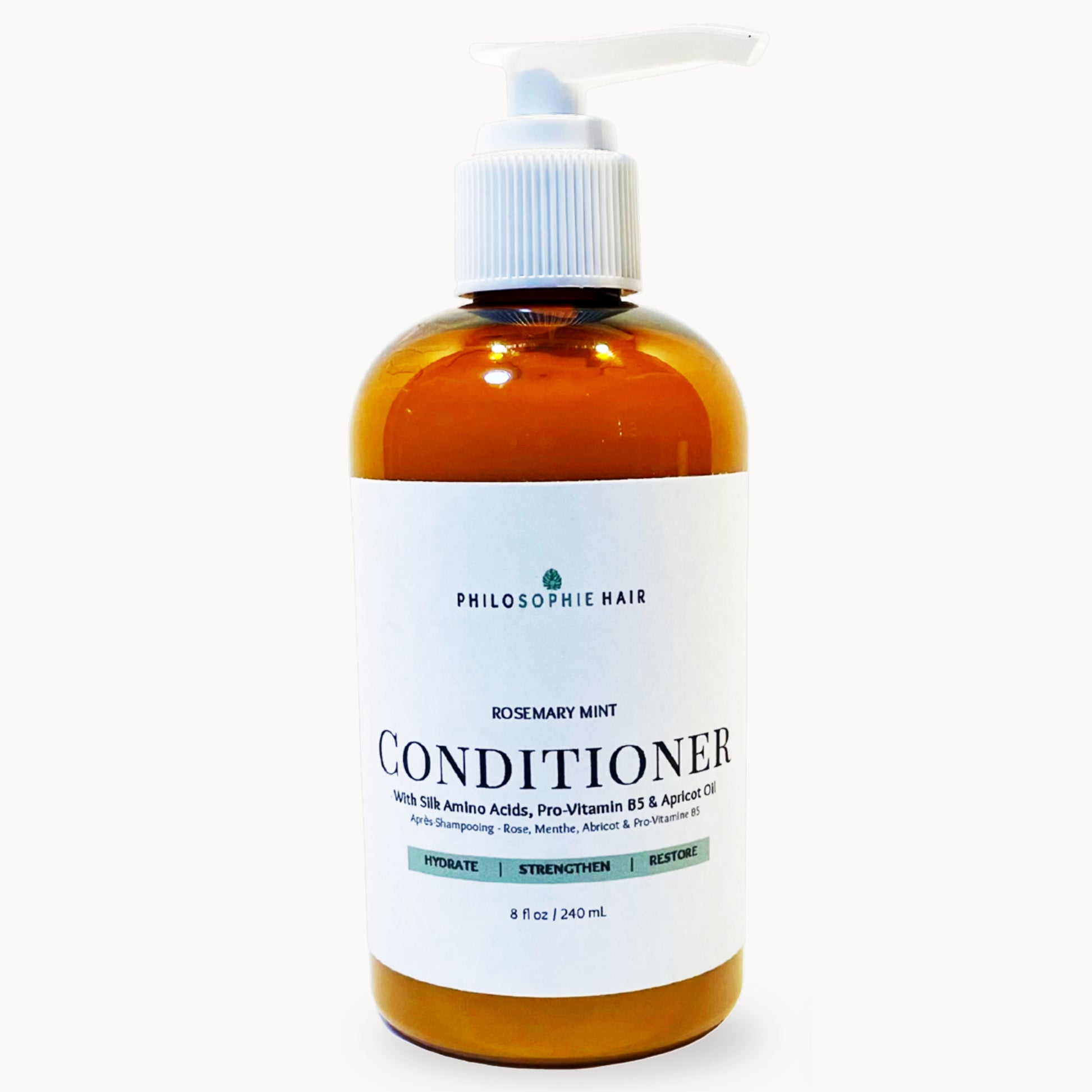 Bottle of Philosophy Hair Rosemary Mint Conditioner on a white background