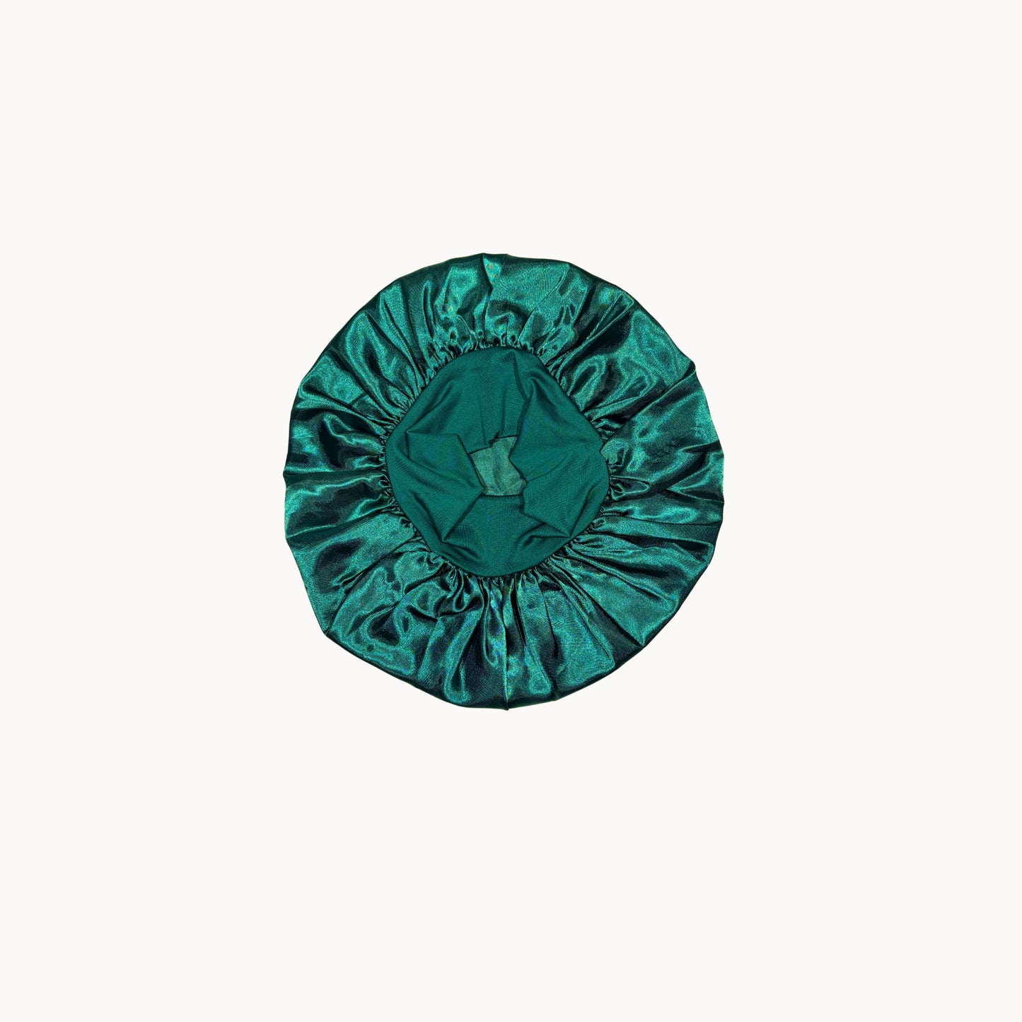Green satin hair bonnet on a white background