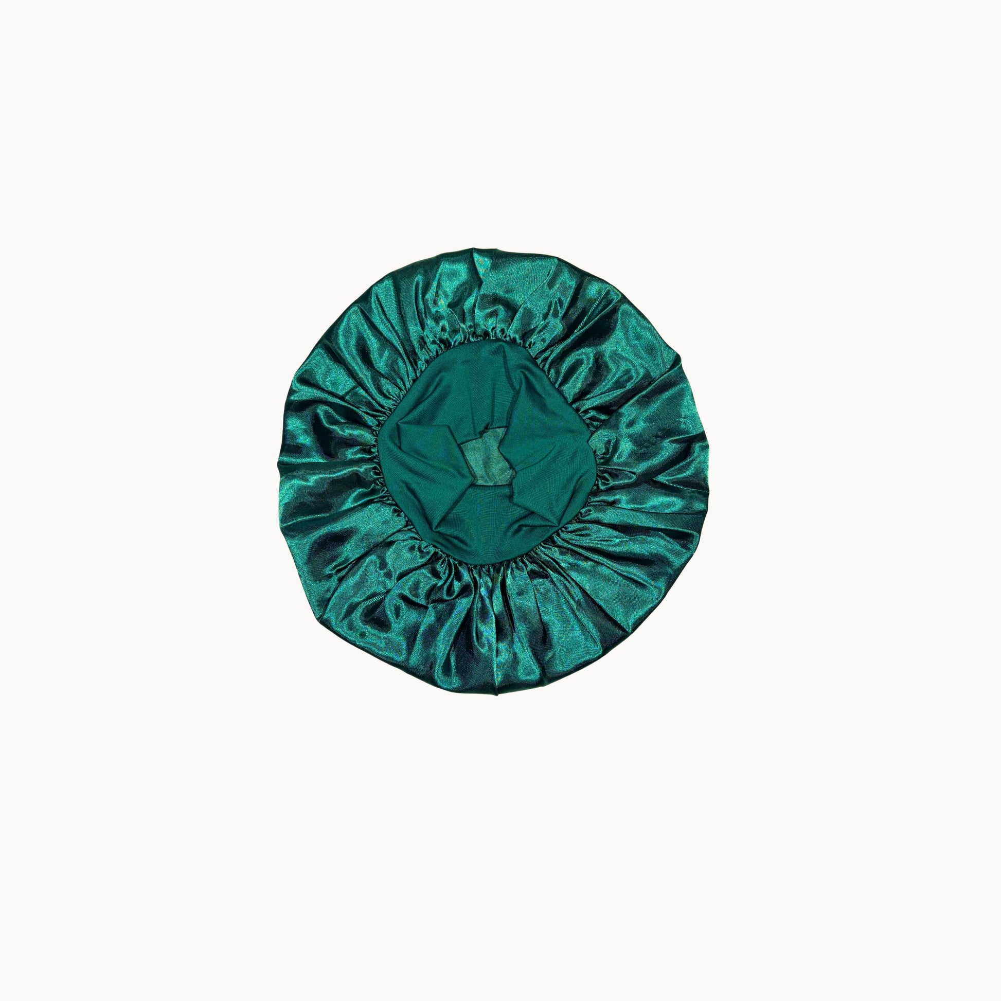 Green satin hair bonnet on a white background