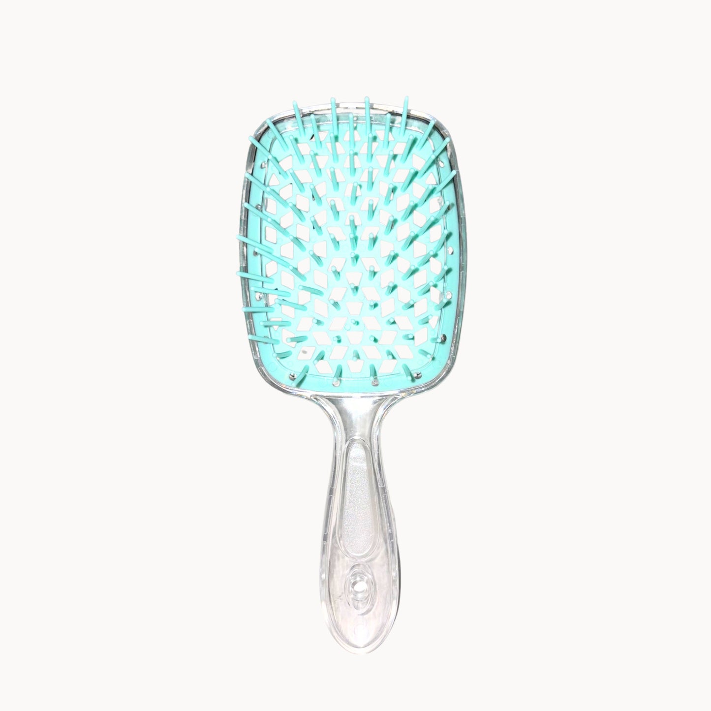 Turquoise hairbrush with clear handle on a white background