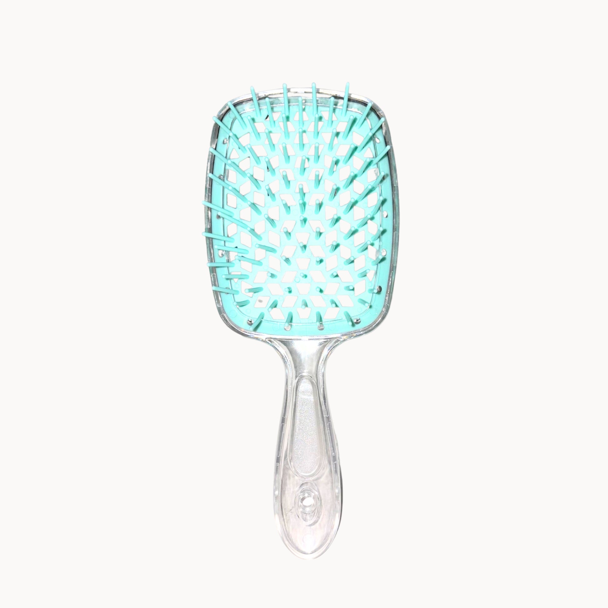 Turquoise hairbrush with clear handle on a white background