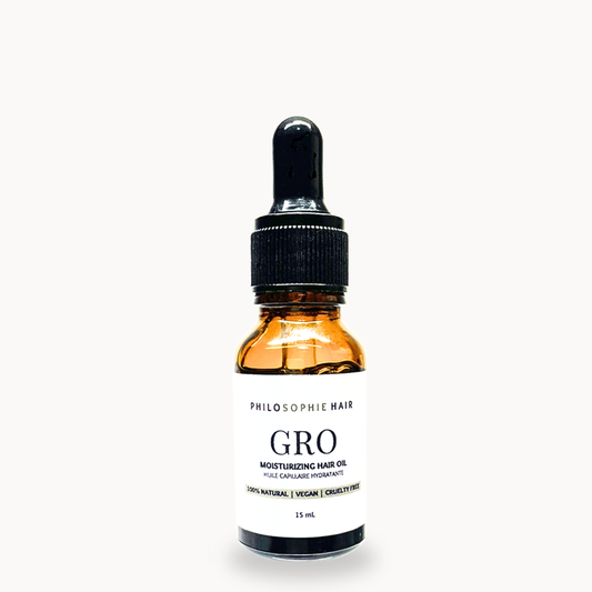 Bottle of Philosophe Hair Gro Moisturizing Hair Oil on a white background