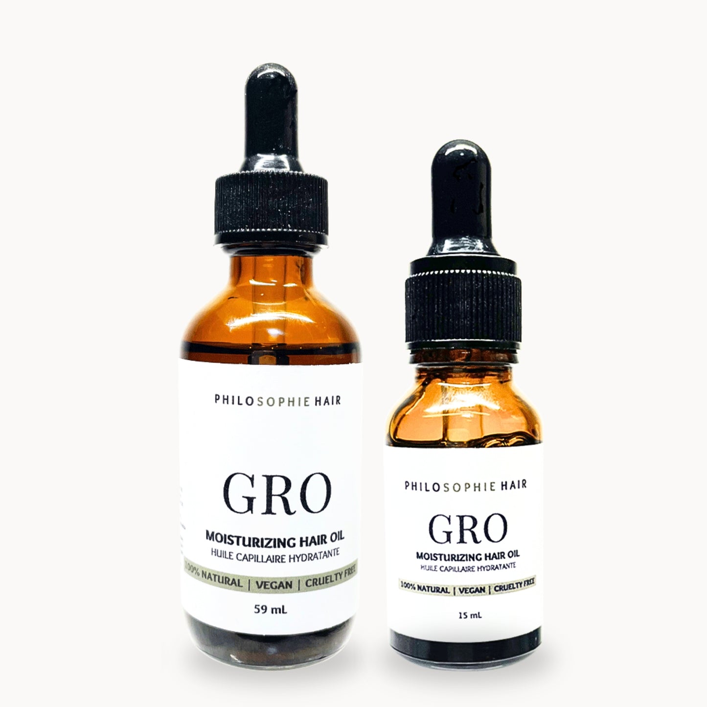 Two bottles of Phil Sophie Hair Gro Moisturizing Hair Oil on a white background
