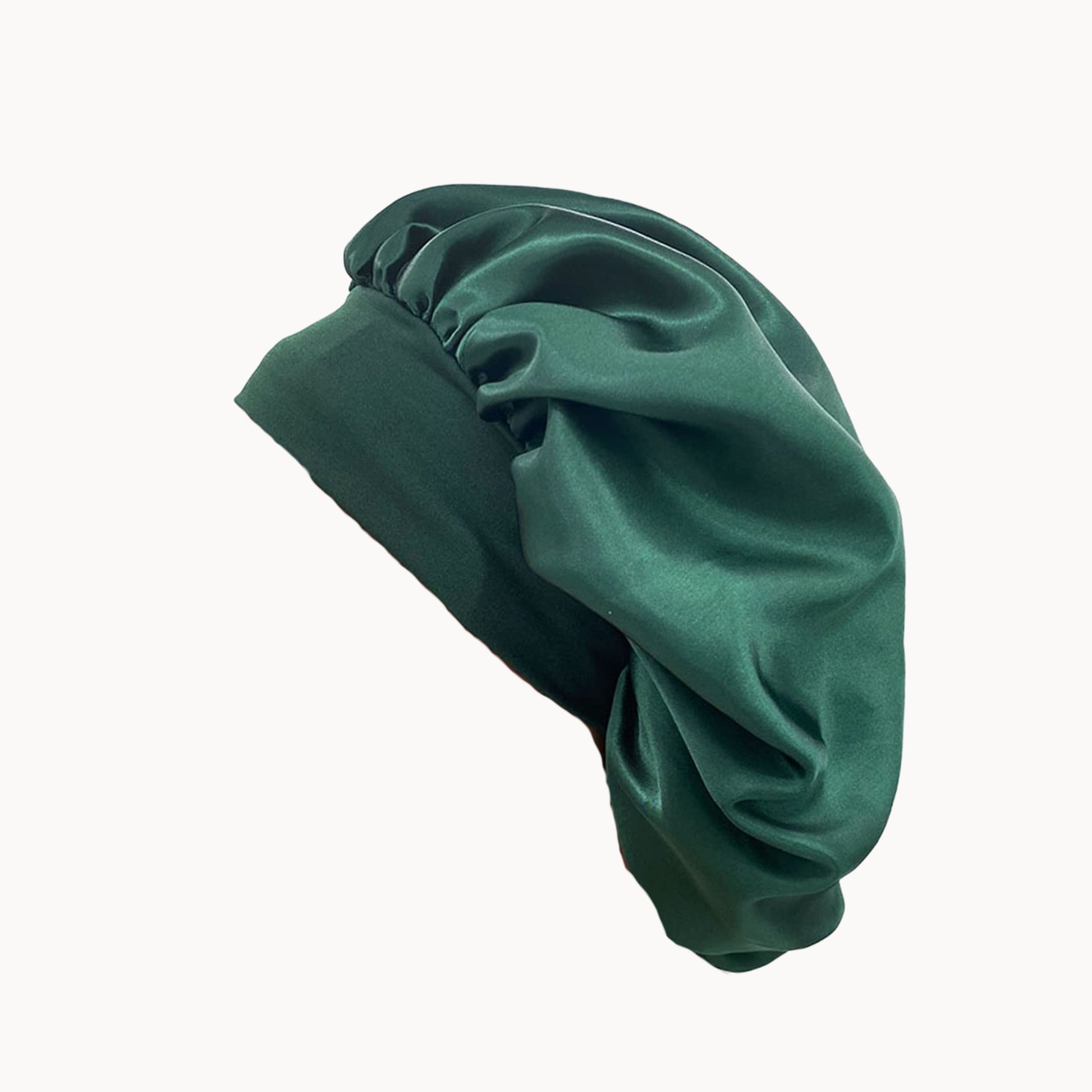 Green satin bonnet on a white background