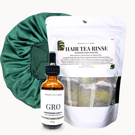 Hair care products including a bottle labeled 'GRO', a hair tea rinse package, and a green satin bonnet on a white background.