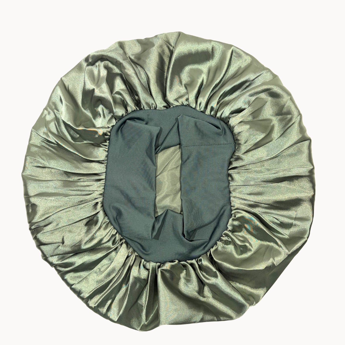 Green satin hair bonnet on a white background